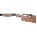 Strzelba PERAZZI High Tech Black kal. 12/76 - zbliżenie na regulowaną kolbę z widocznym mechanizmem regulacji grzebienia